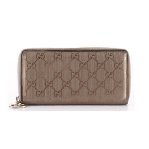 Authentic Gucci Zippy Wallet in Taupe Metallic Coated Canvas